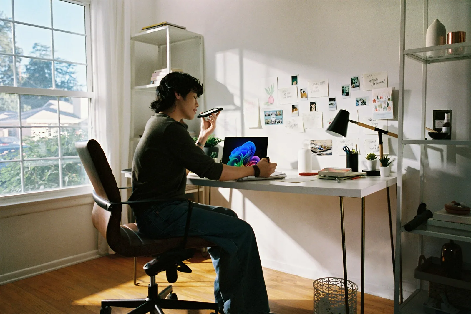 Minimal workspace with laptop showing a website design
